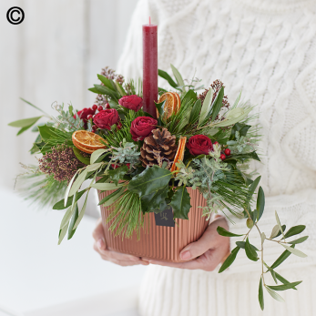 Classic Christmas Flowers Arranged With A Candle
