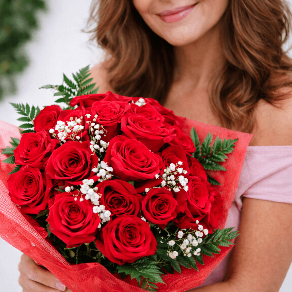 Smiling Woman With Red Roses Bouquet