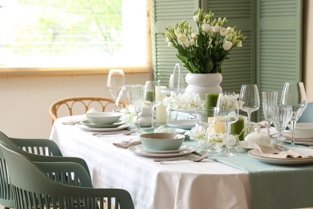 Dining Table With White And Green Flower Arrangements
