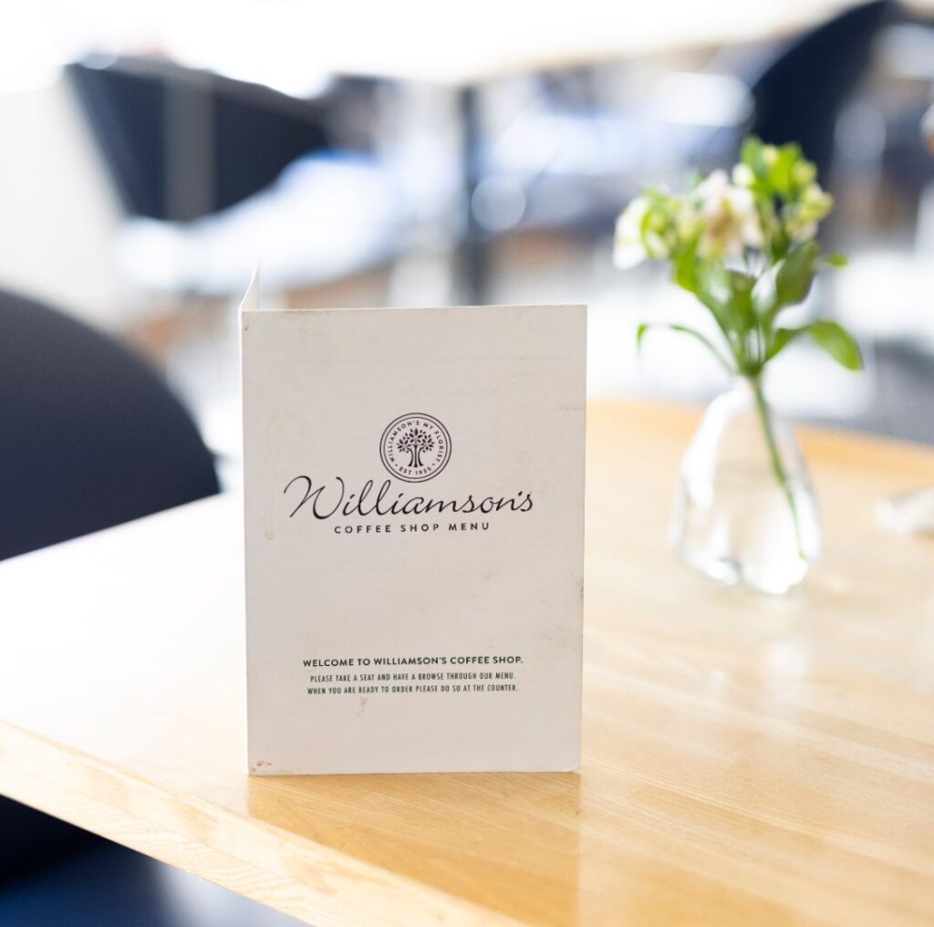 Coffee table within the Livingston garden centre displaying the Williamson's coffee shop menu.