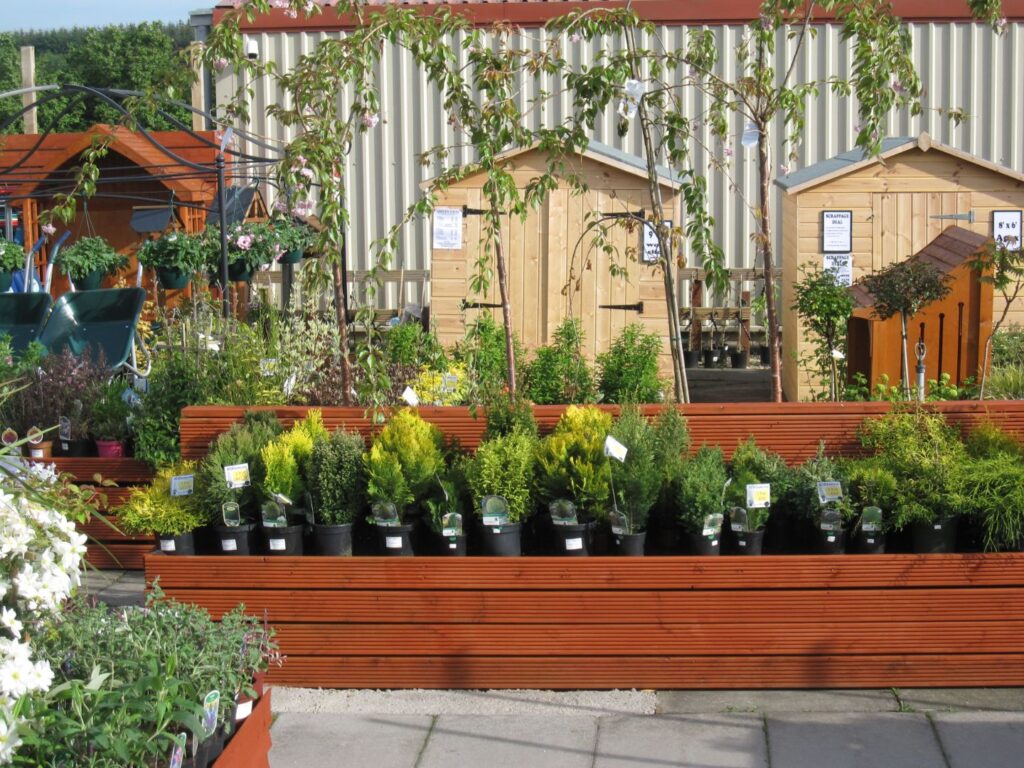 Garden sheds, conifers and potted plants for sale at Williamson's Garden Centre Livingston