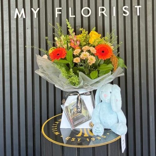 Bright flower bouquet with Steiff My First Teddy Bear new baby gift