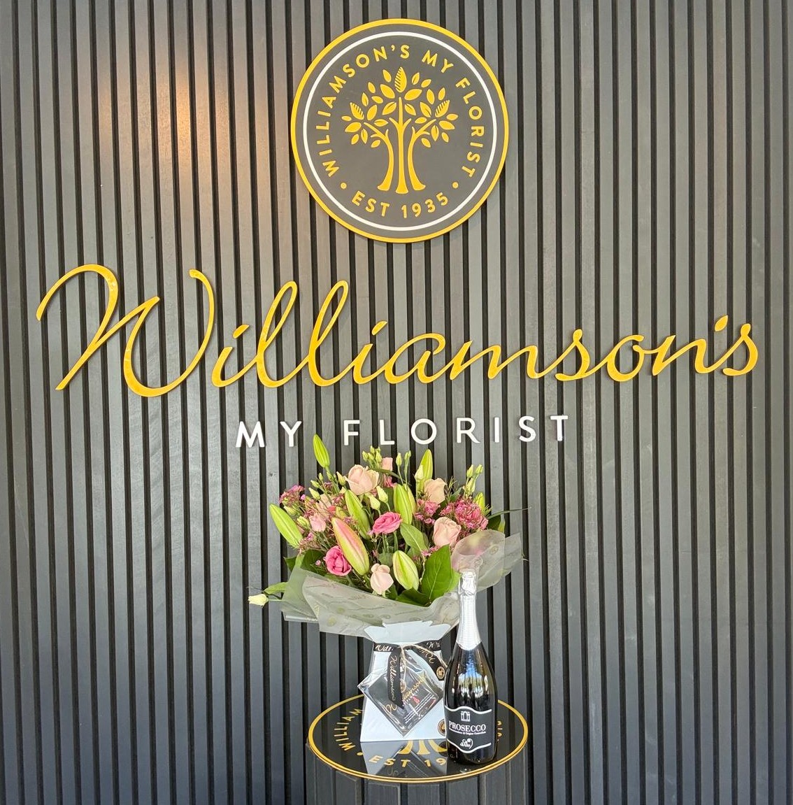 Bright florist choice bouquet with Prosecco from Williamson’s Myflorist Rose and Lily Bouquet with Prosecco from Williamson’s Myflorist